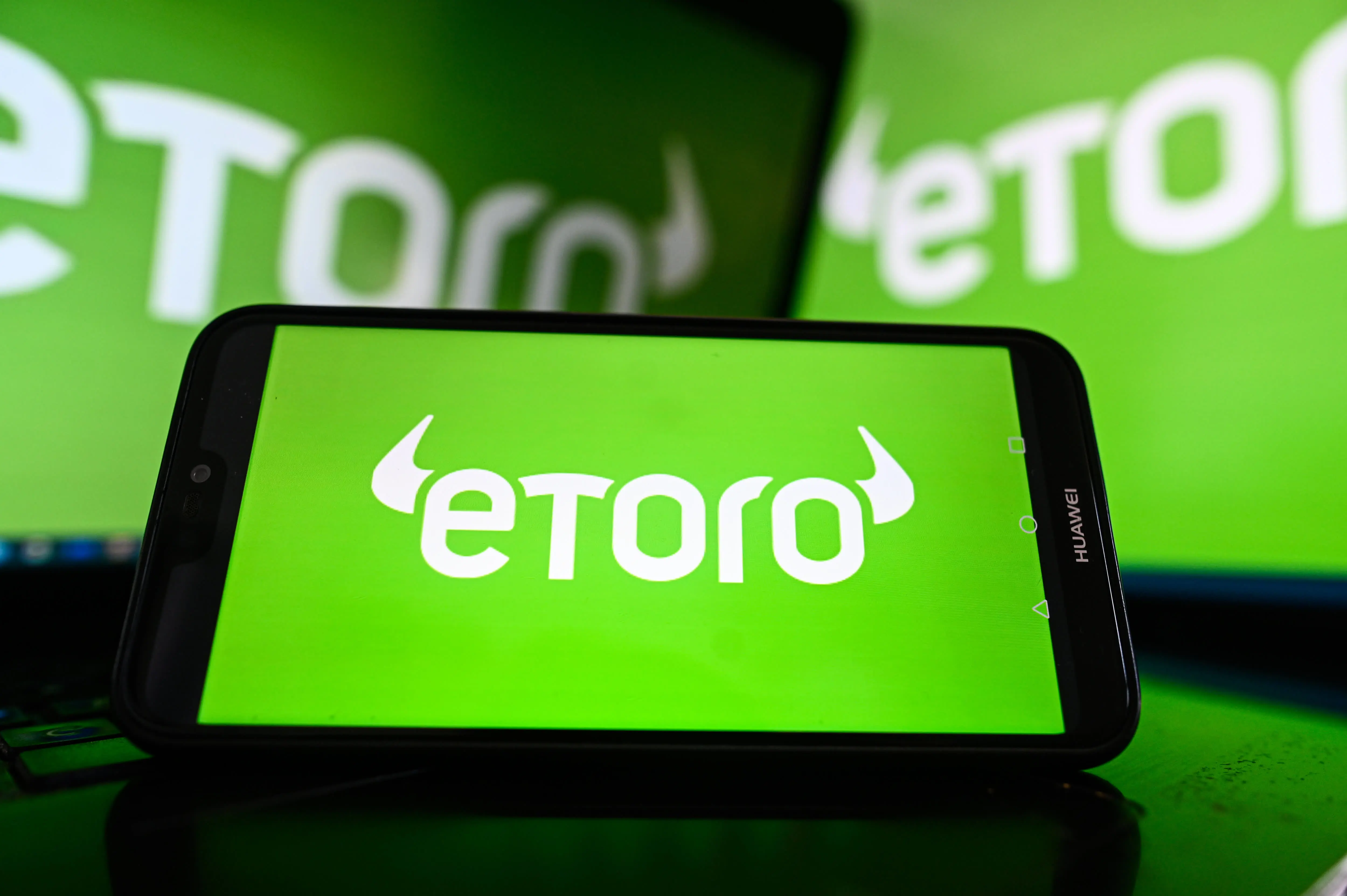 Stock and crypto trading site eToro prices IPO at $52 per share ahead of Nasdaq debut